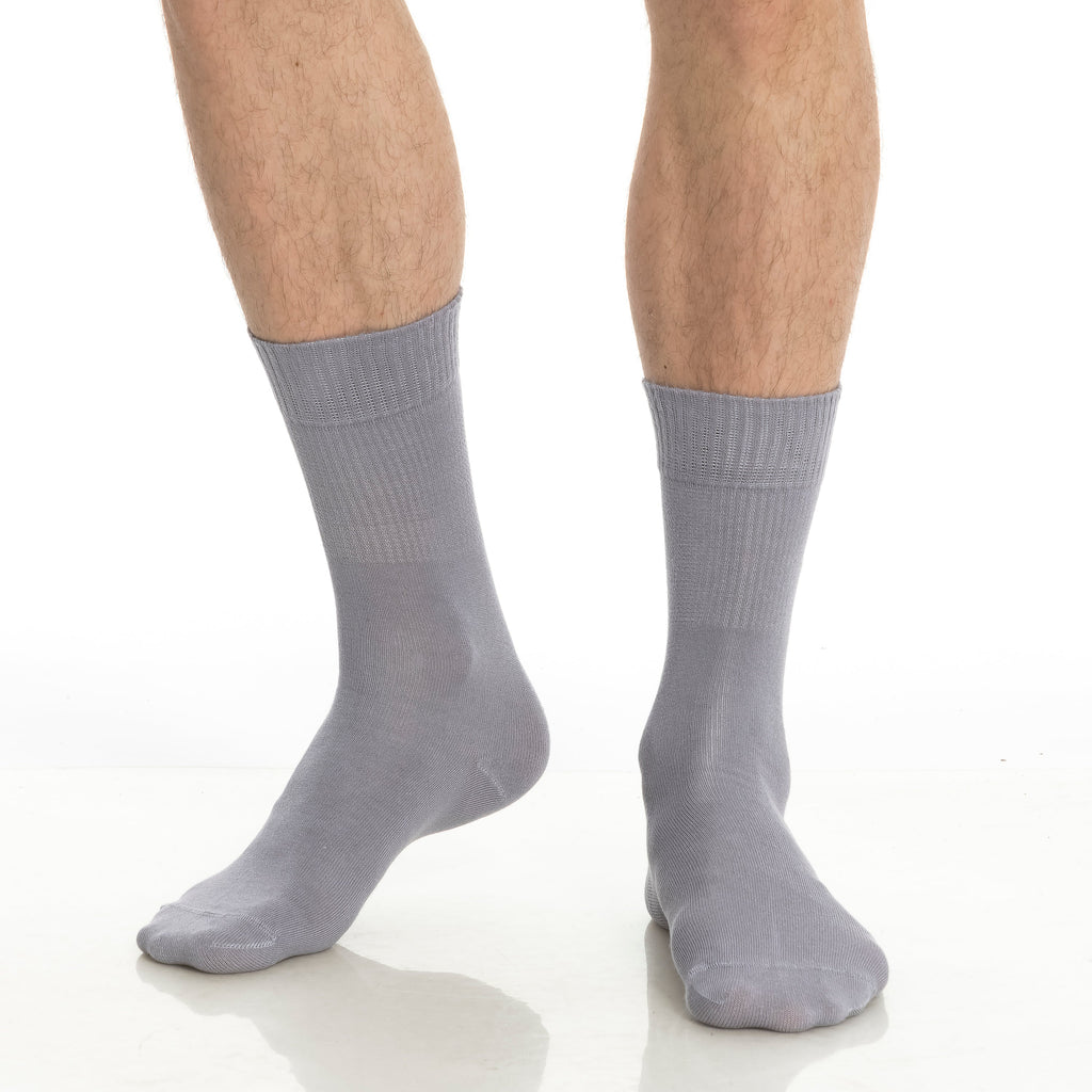 Light gray crew socks on feet, ribbed texture and cushioned heel