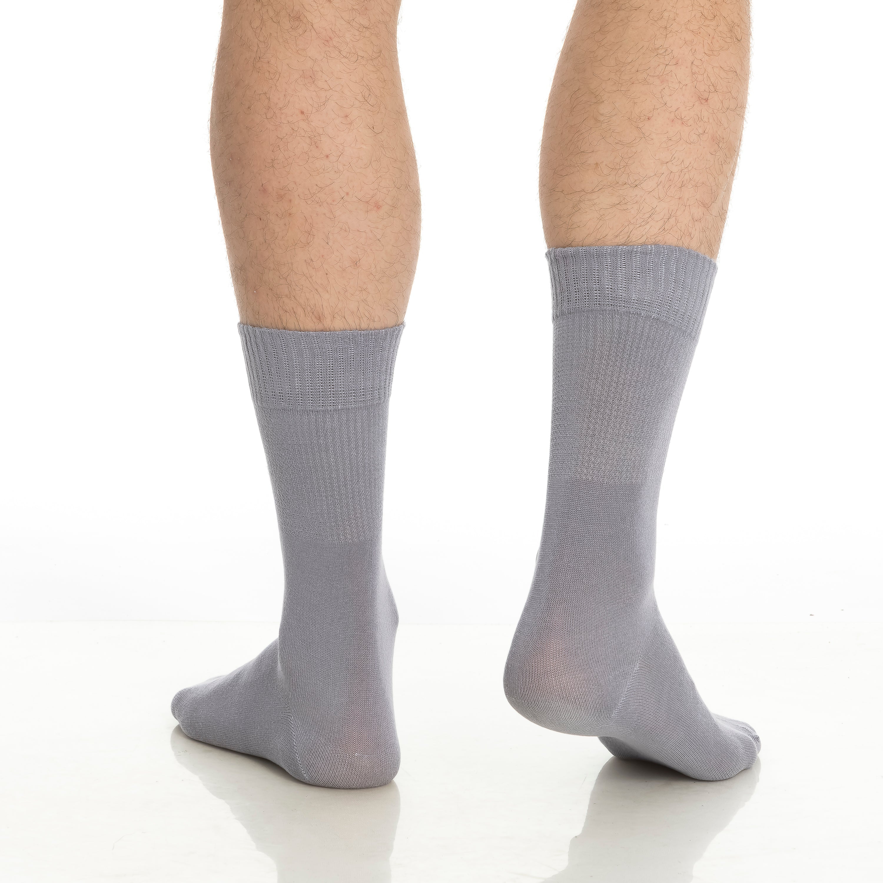 Light gray crew socks, mid-calf length, ribbed cuffs and knit pattern