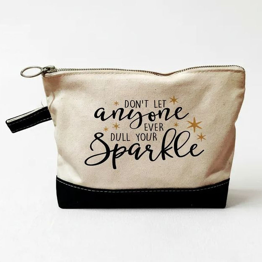 Beige canvas zippered pouch with black bottom and 'anyone ... Sparkle' lettering.