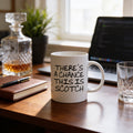 White ceramic coffee mug with humorous quote: “There’s a chance this is Scotch.”