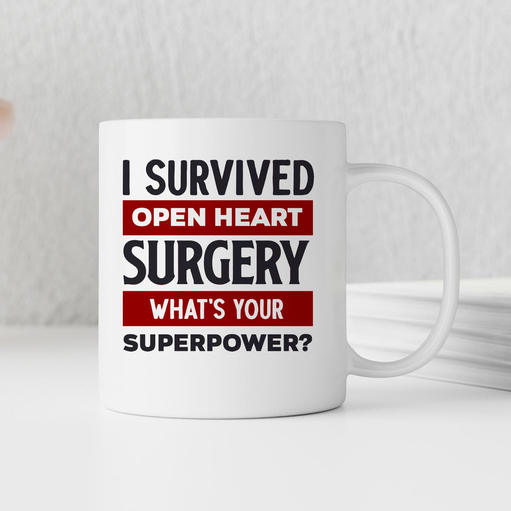 White coffee mug with slogan: I Survived Open Heart Surgery, What’s Your Superpower?