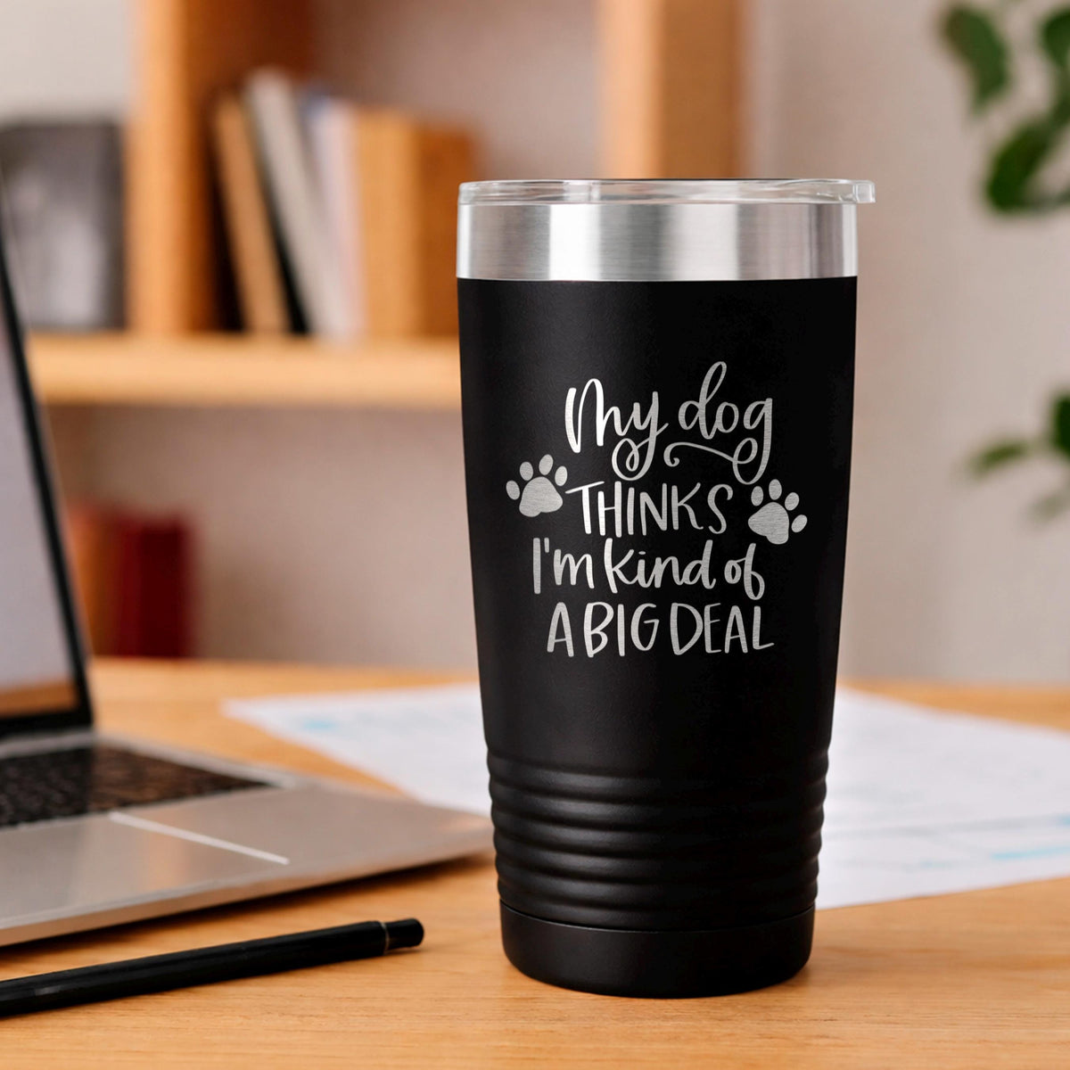 Black stainless steel travel tumbler, dog paw quote: “My dog thinks I’m kind of a big deal”.