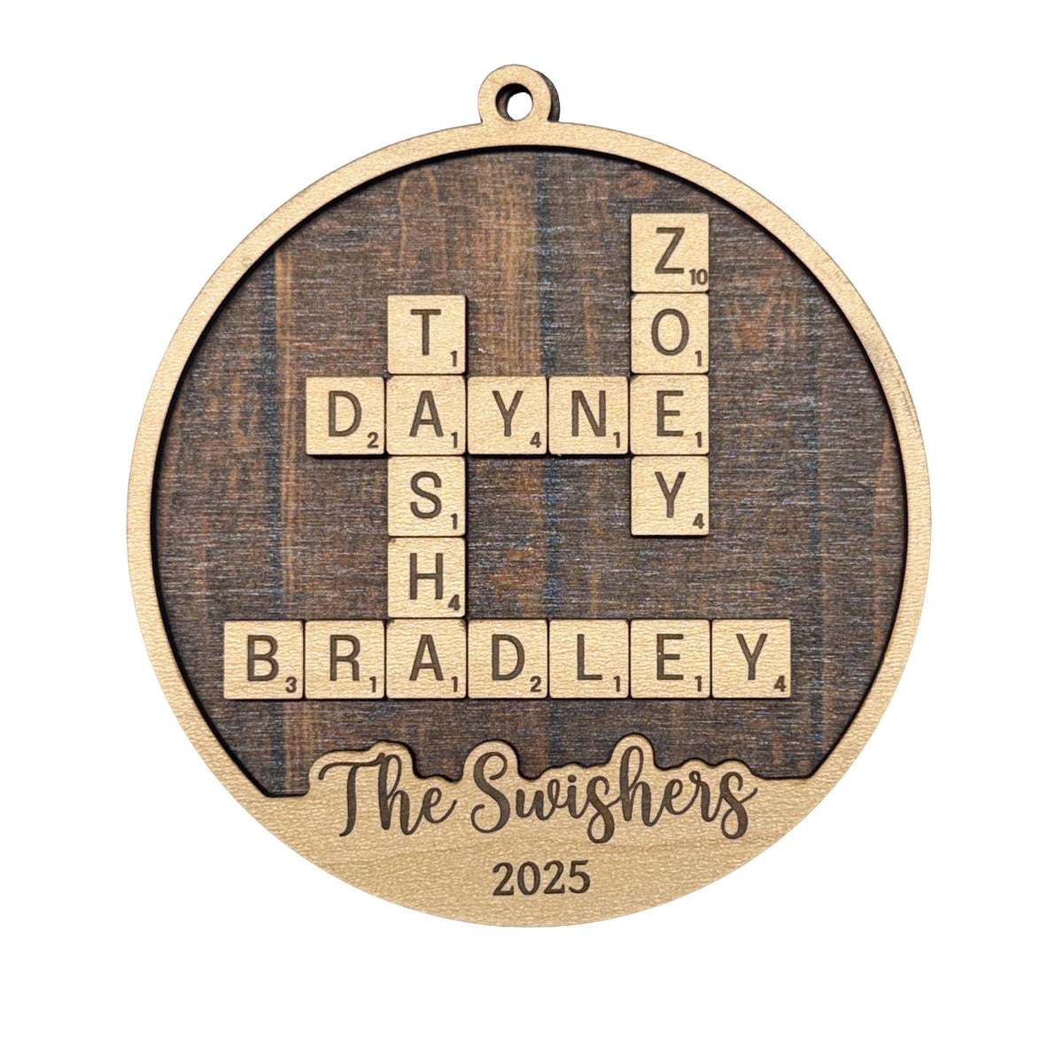 Round wooden Christmas ornament with laser-engraved word puzzle, "The Swishers" 2025