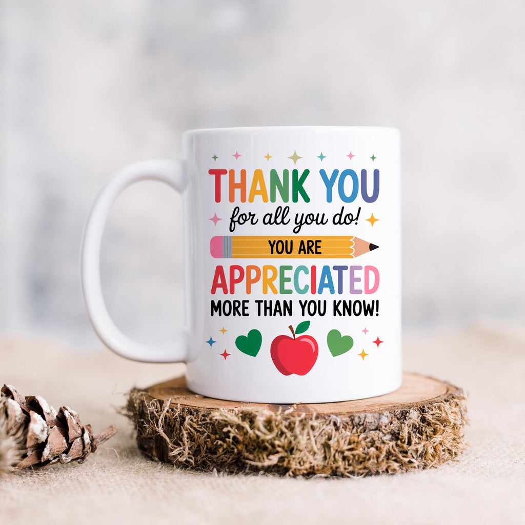 White ceramic thank-you mug with “Thank You” and “You are appreciated” lettering and heart icons