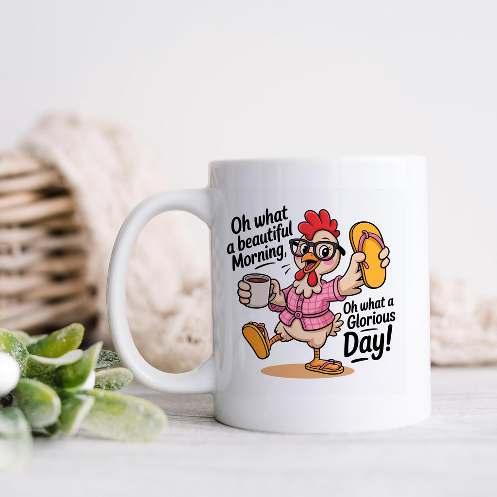 White ceramic mug with handle, featuring a colorful chicken holding a coffee cup graphic
