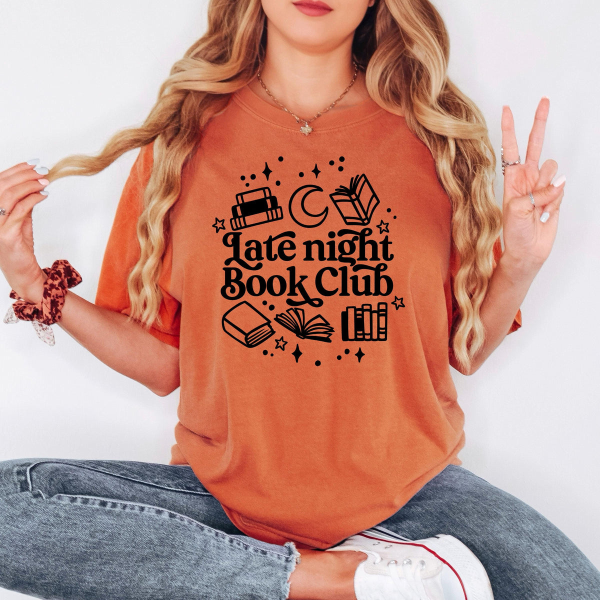 Orange crewneck tee with 'Late night Book Club' book, moon, and city graphic