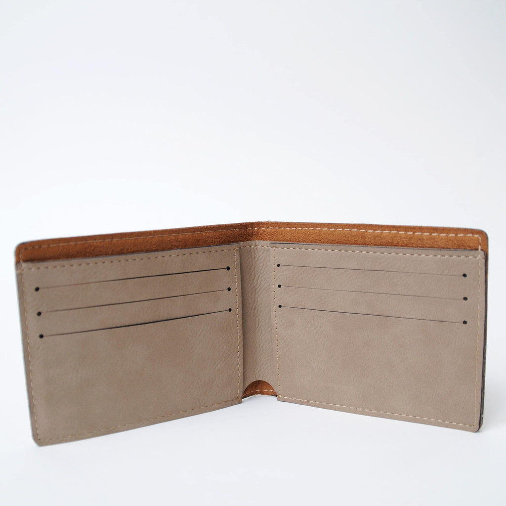 Open brown leather bifold wallet with two sections and multiple card slots