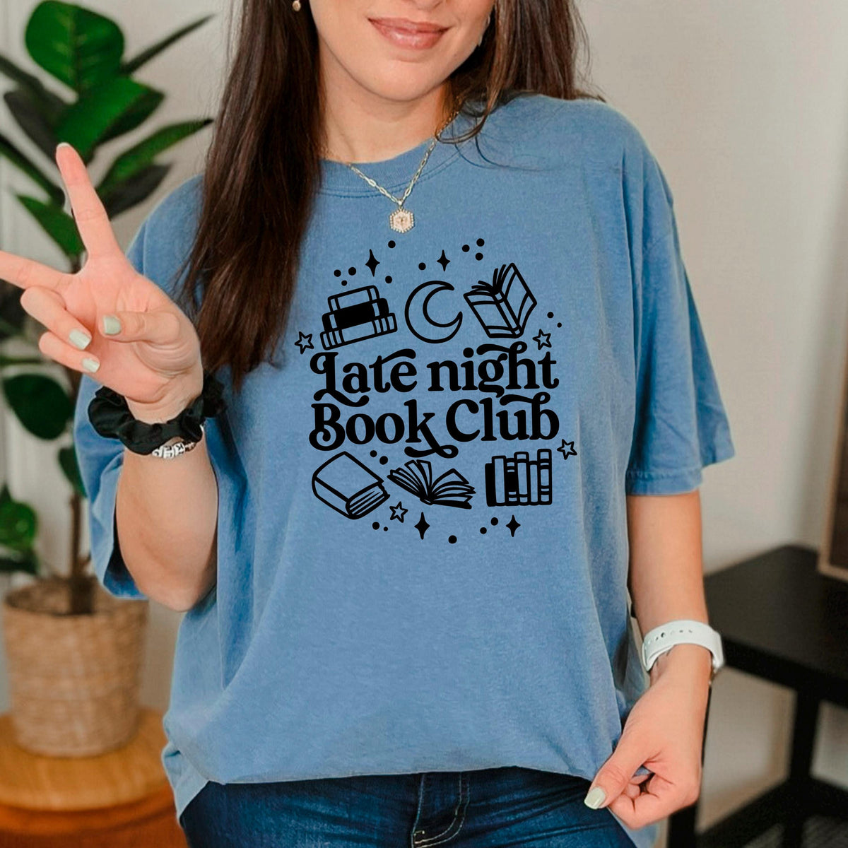 Blue crewneck short-sleeve tee with 'Late night Book Club' books and moon graphic