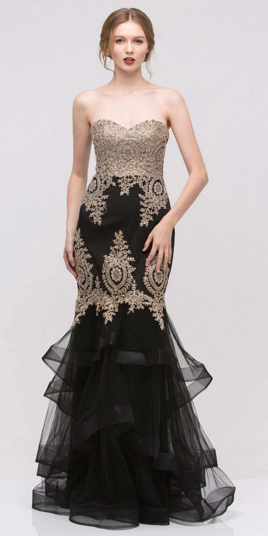Black strapless embroidered gown with layered tulle skirt and gold lace motifs