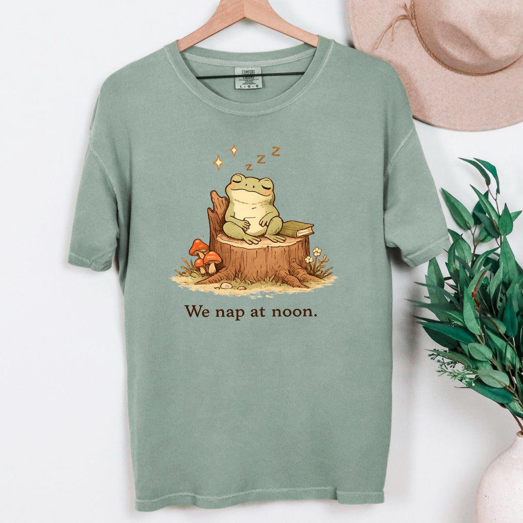 Moss green frog T-shirt with sleeping frog on stump and “We nap at noon.” print