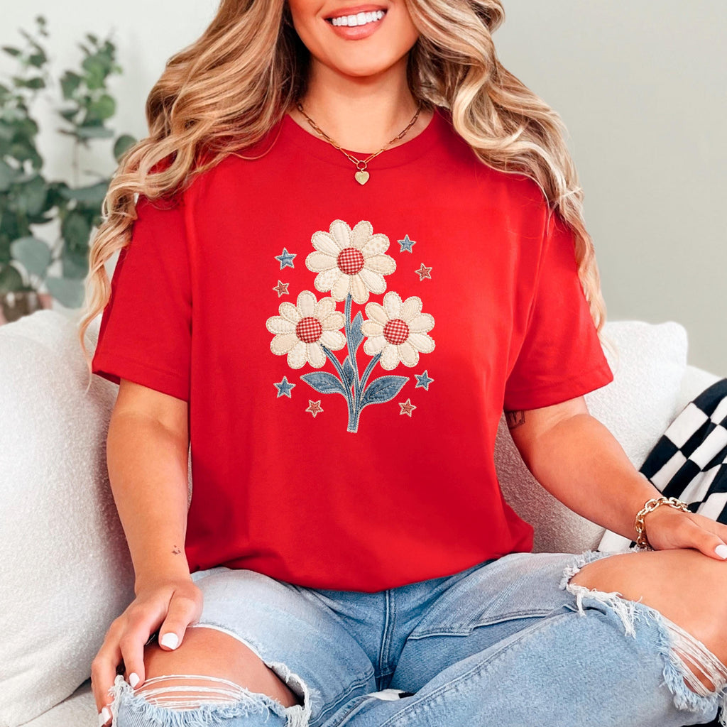 Red unisex crewneck T-shirt with three cream-and-red daisies and star pattern