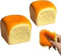 Orange squishy fidget toy roll with cream center, held and squeezed by a hand