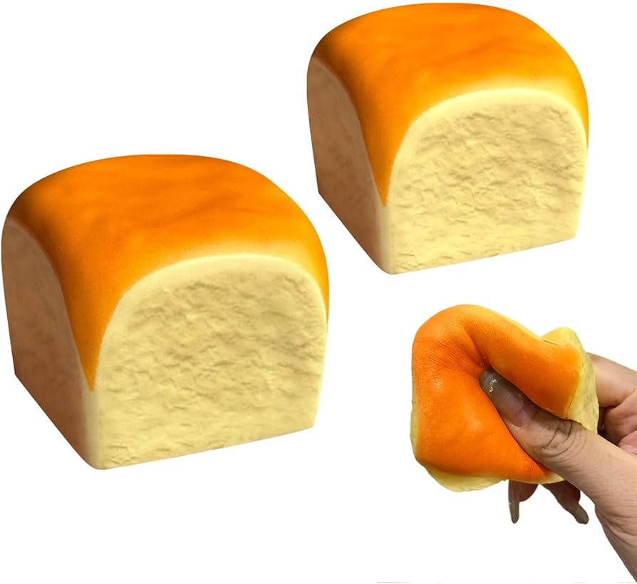Orange squishy fidget toy roll with cream center, held and squeezed by a hand