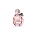 Women's eau de parfum bottle with pink faceted glass and rose-gold cap, V&R badge