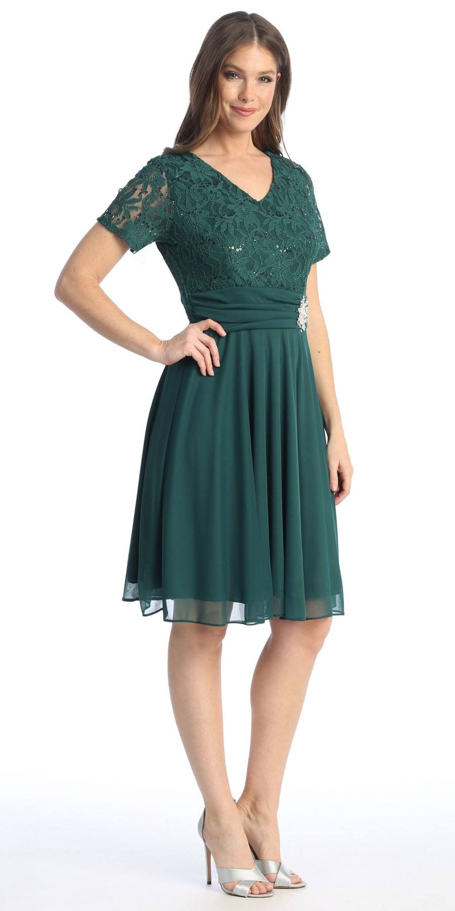 Teal knee-length dress with short sleeves, V-neck, and beaded waist detail