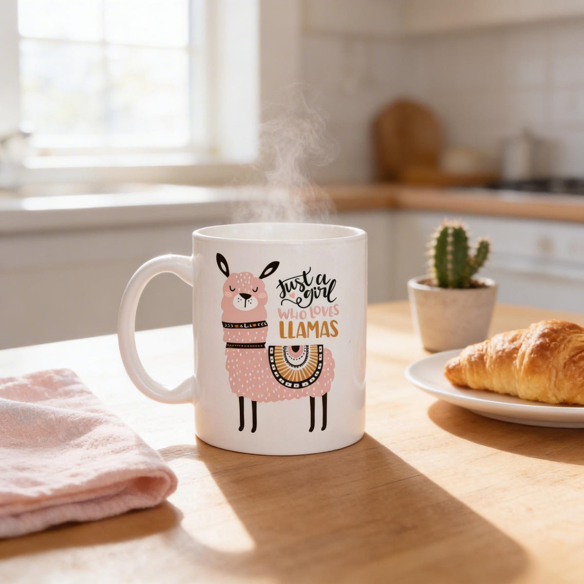 Ceramic llama coffee mug on table with croissant, white cup with colorful llama print