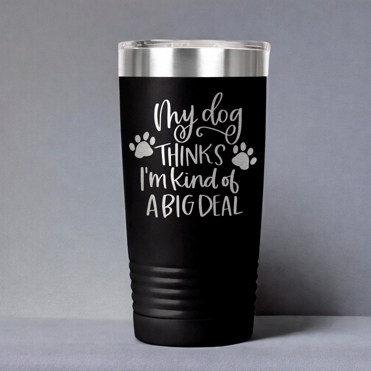 Black stainless steel travel tumbler with dog paw quote: “My dog thinks I’m kind of a big deal”.