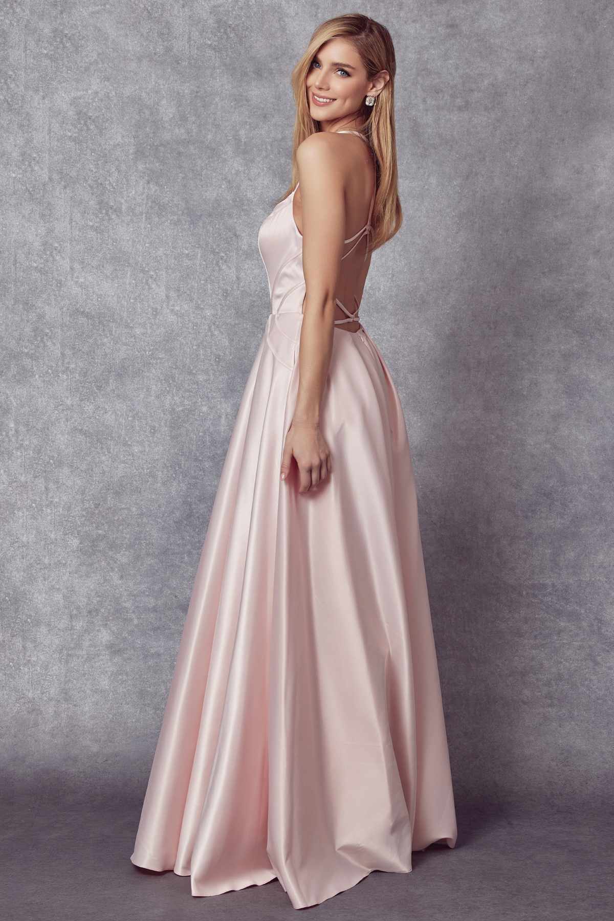 Blush shiny satin A-line prom gown with spaghetti straps and flared full skirt