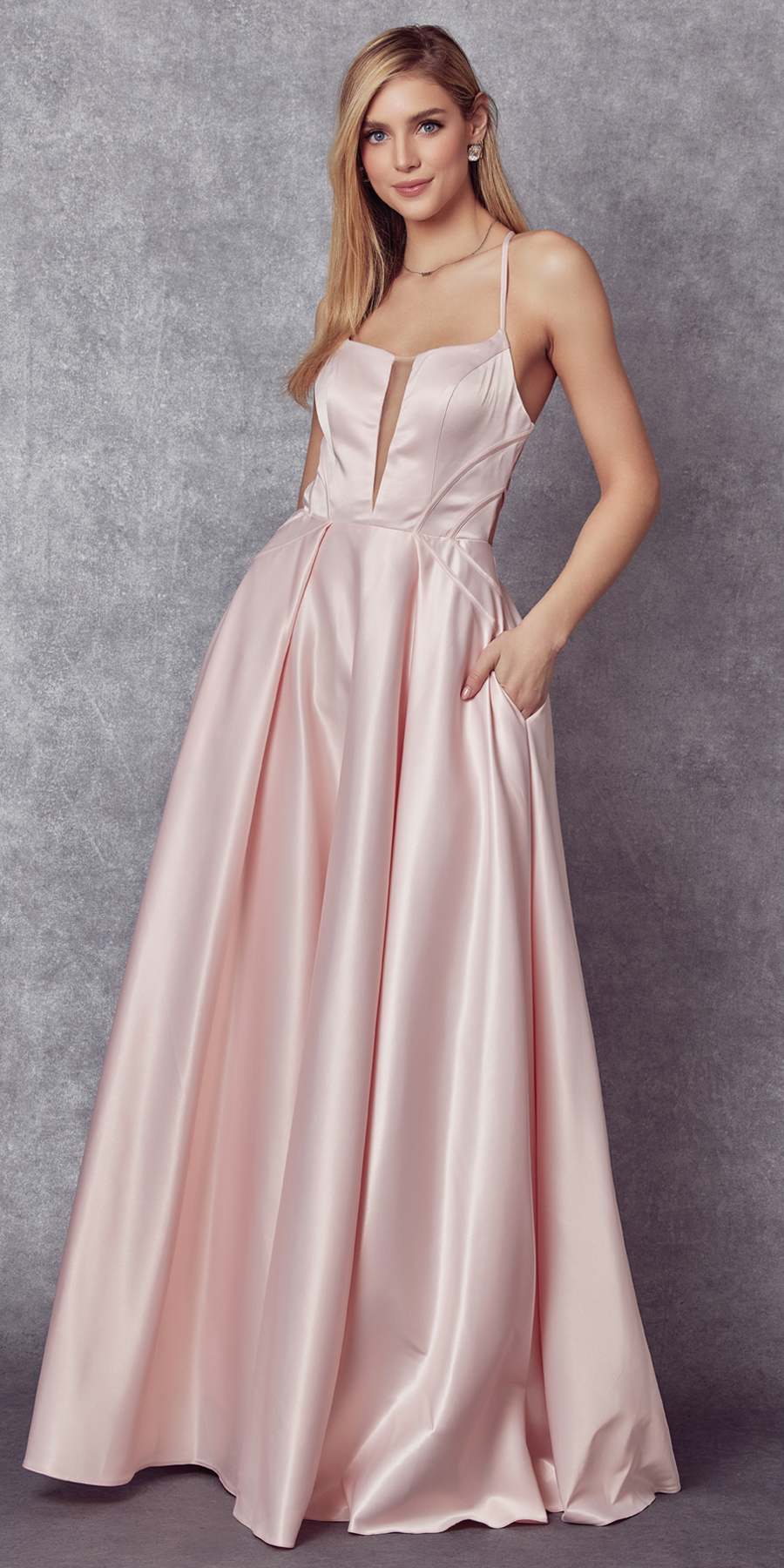 Blush shiny satin A-line prom gown with spaghetti straps and fitted bodice