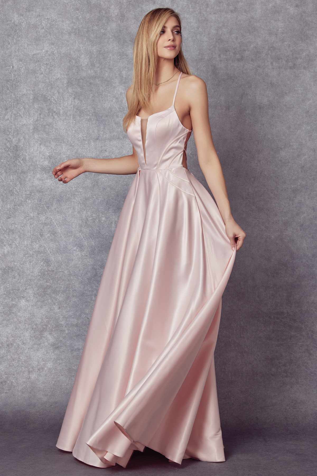Blush shiny satin A-line prom gown with spaghetti straps and draped skirt