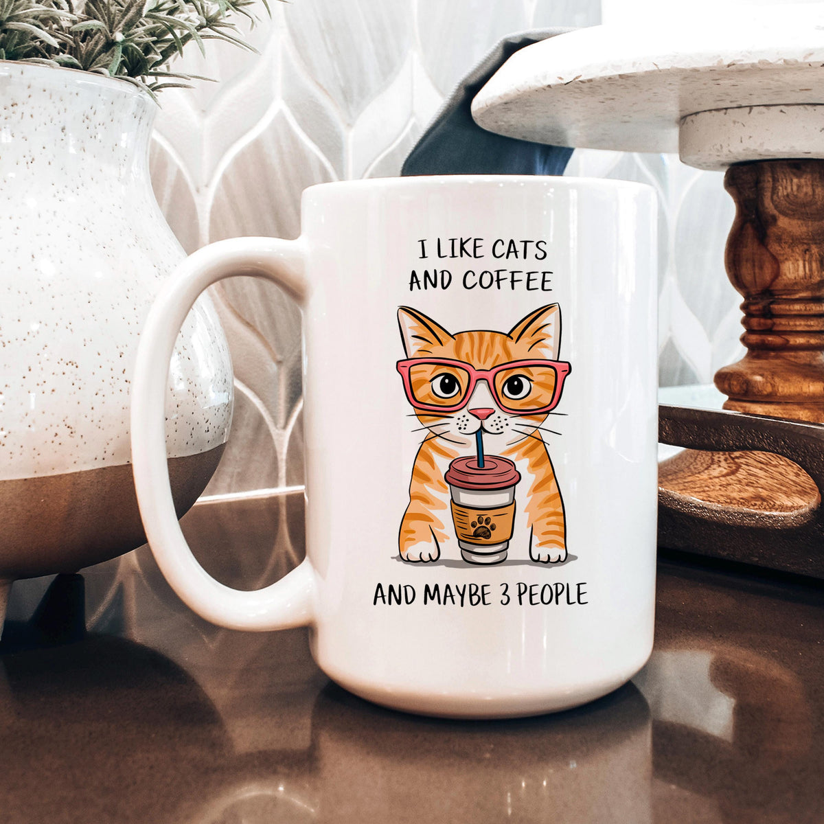 White ceramic coffee mug with orange tabby cat graphic and “I like cats and coffee”