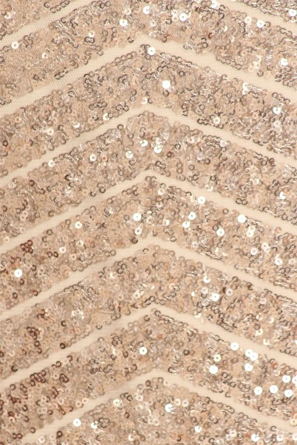 Rose gold sequin fabric with geometric beadwork pattern and sparkling highlights.