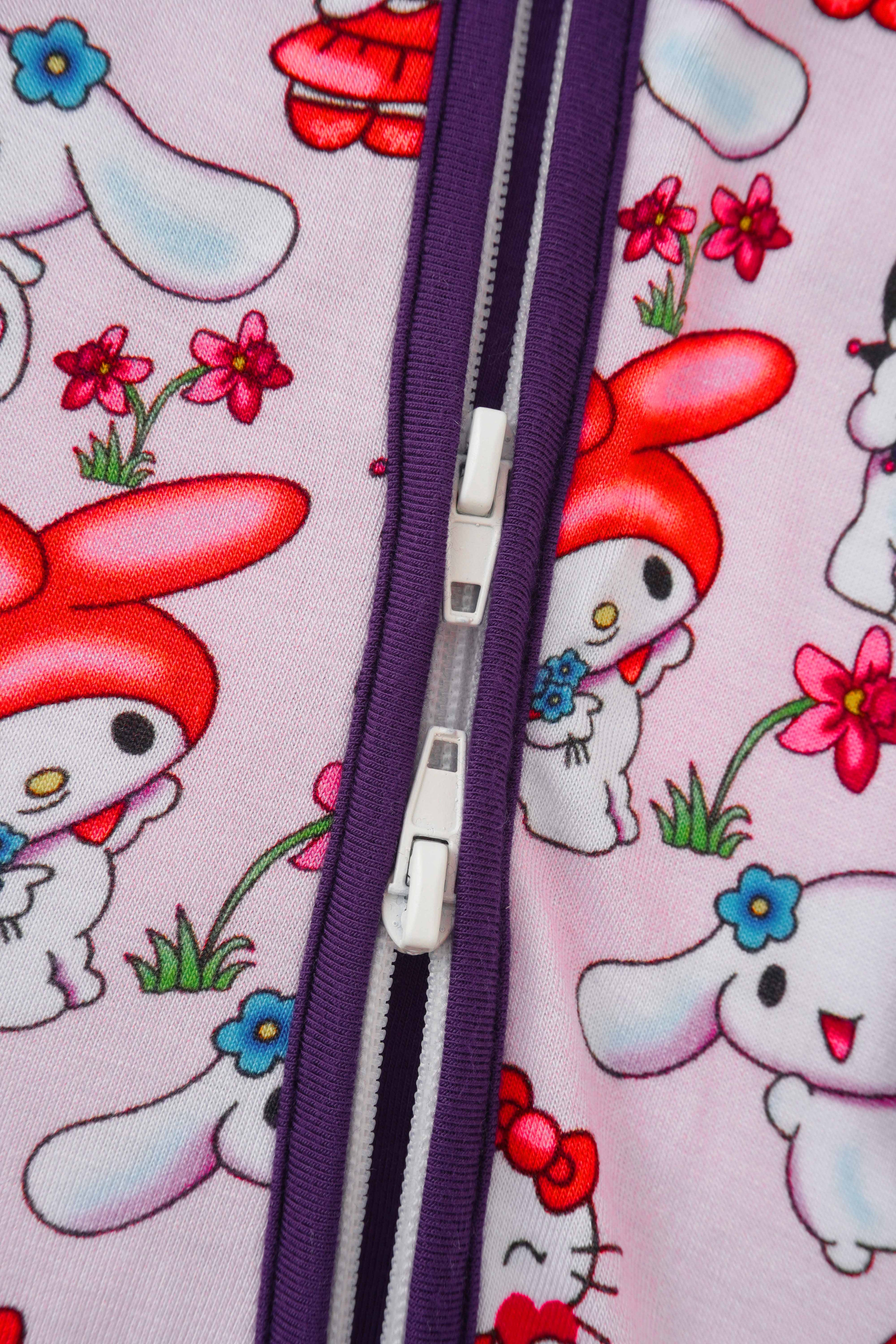 Baby romper front zipper in purple with character print fabric close-up