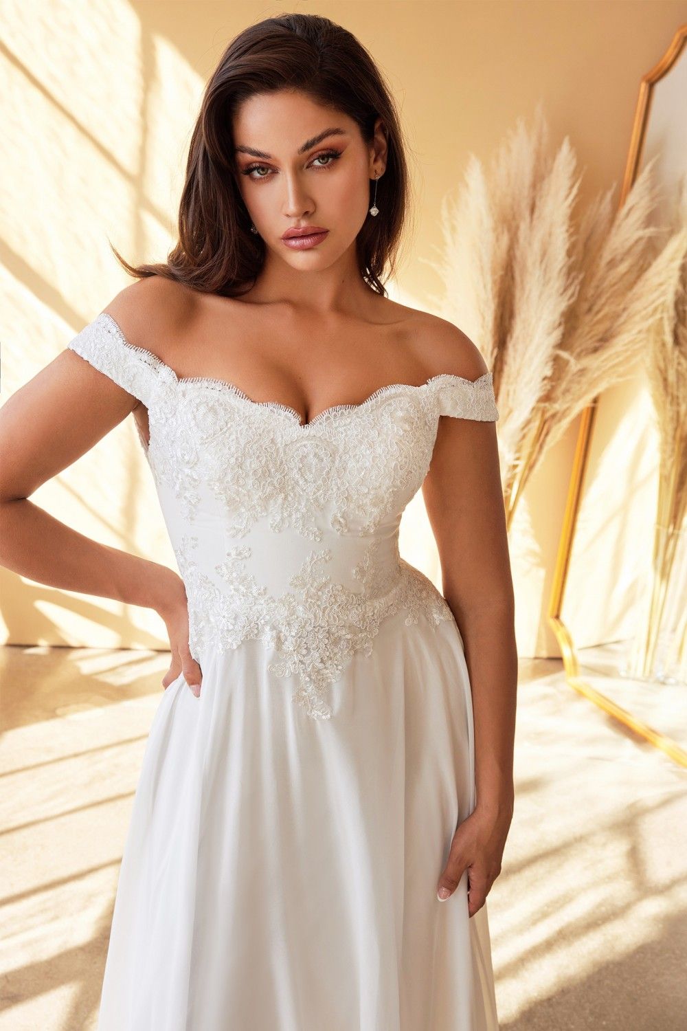 Off-shoulder off-white lace long gown with corset-style bodice detail