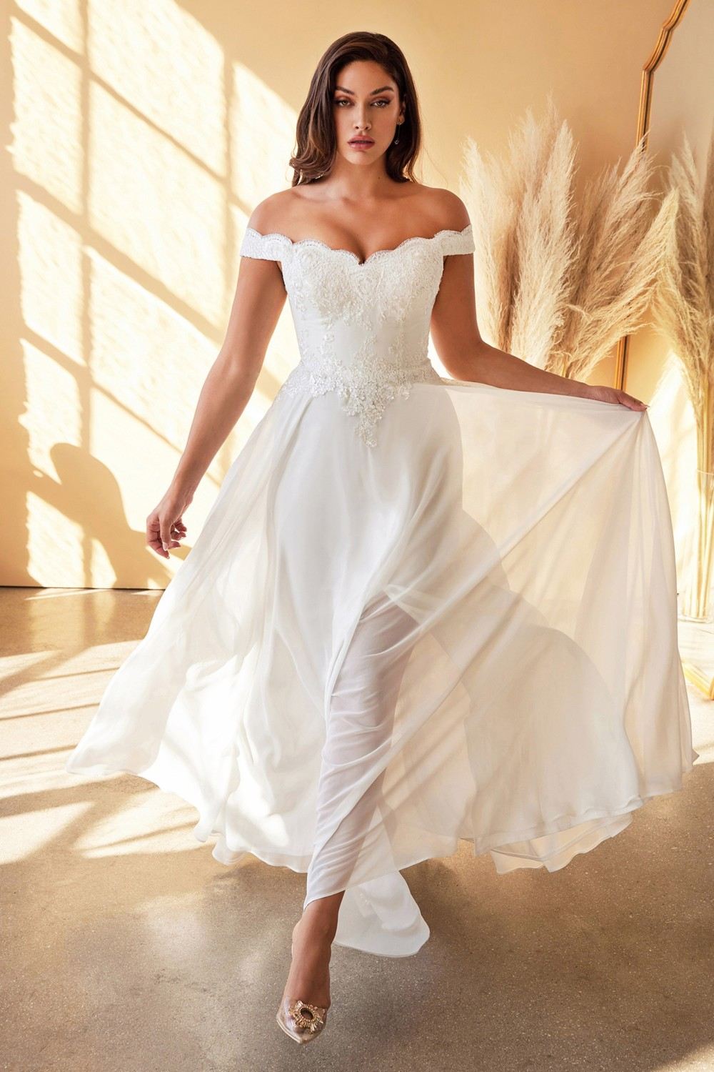 Off-shoulder off-white lace gown with full skirt and layered side drape