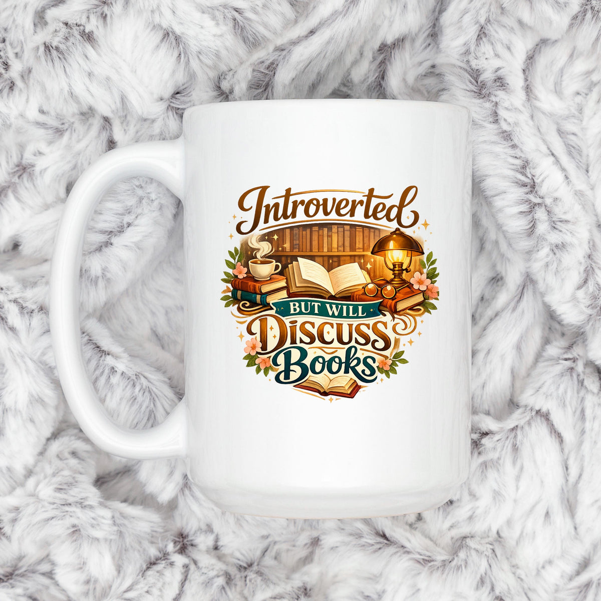 White ceramic mug with colorful "Introverted, but will discuss books" quote