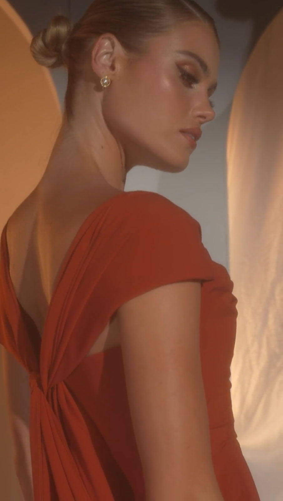 Sienna red ruched dress with short sleeves and side drape