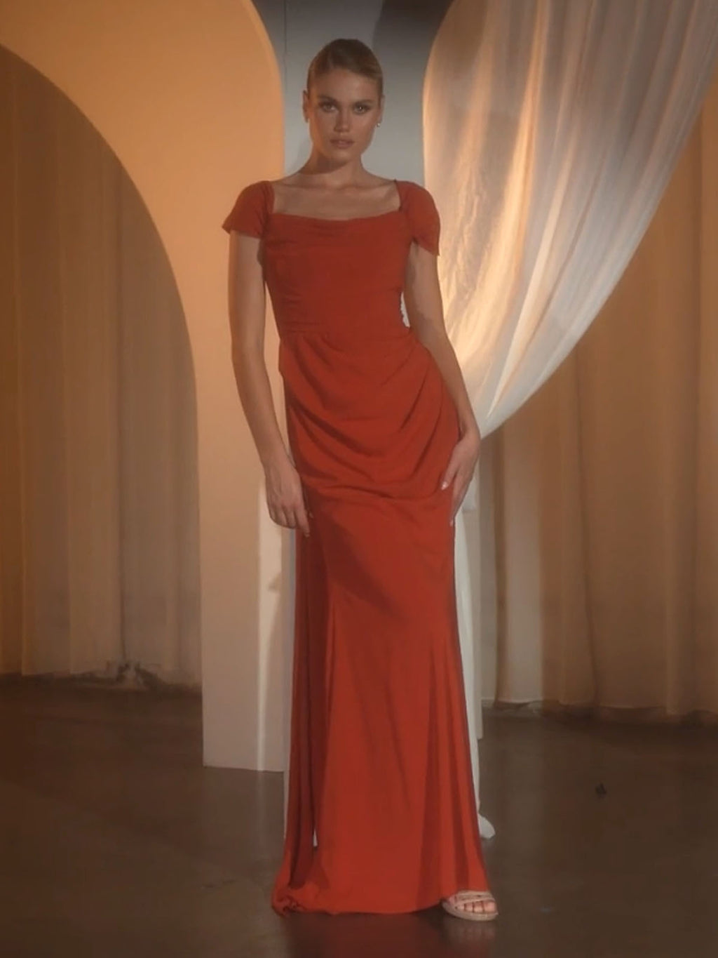 Sienna red short-sleeve evening dress with draped waist and flowing long hem