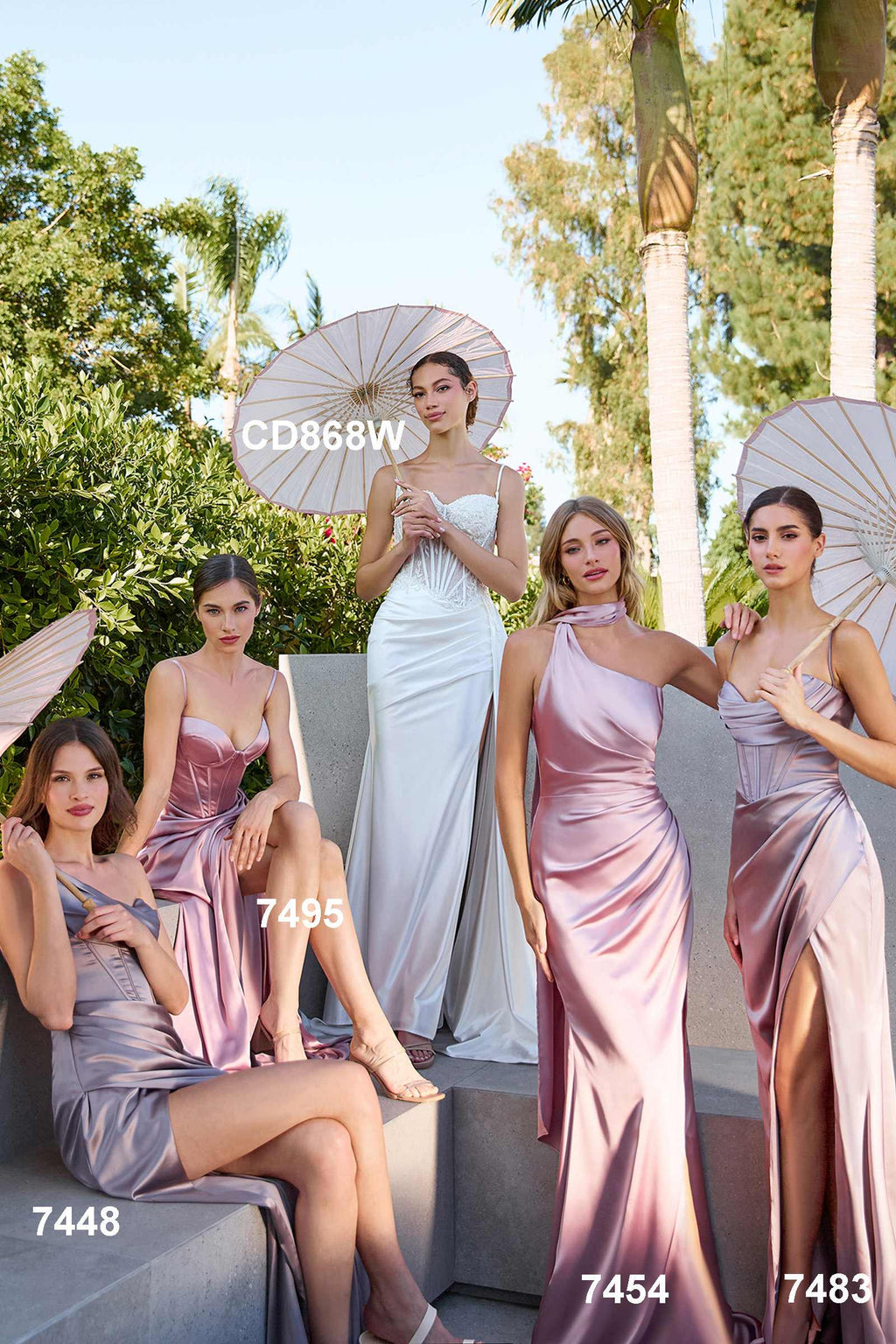 Long satin corset gown with spaghetti straps and thigh-high slit in soft pink