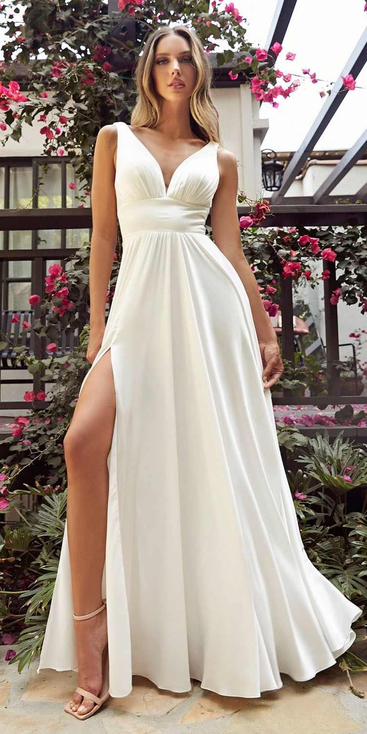 Long formal A-line satin dress with deep V neckline and gathered waist, full skirt