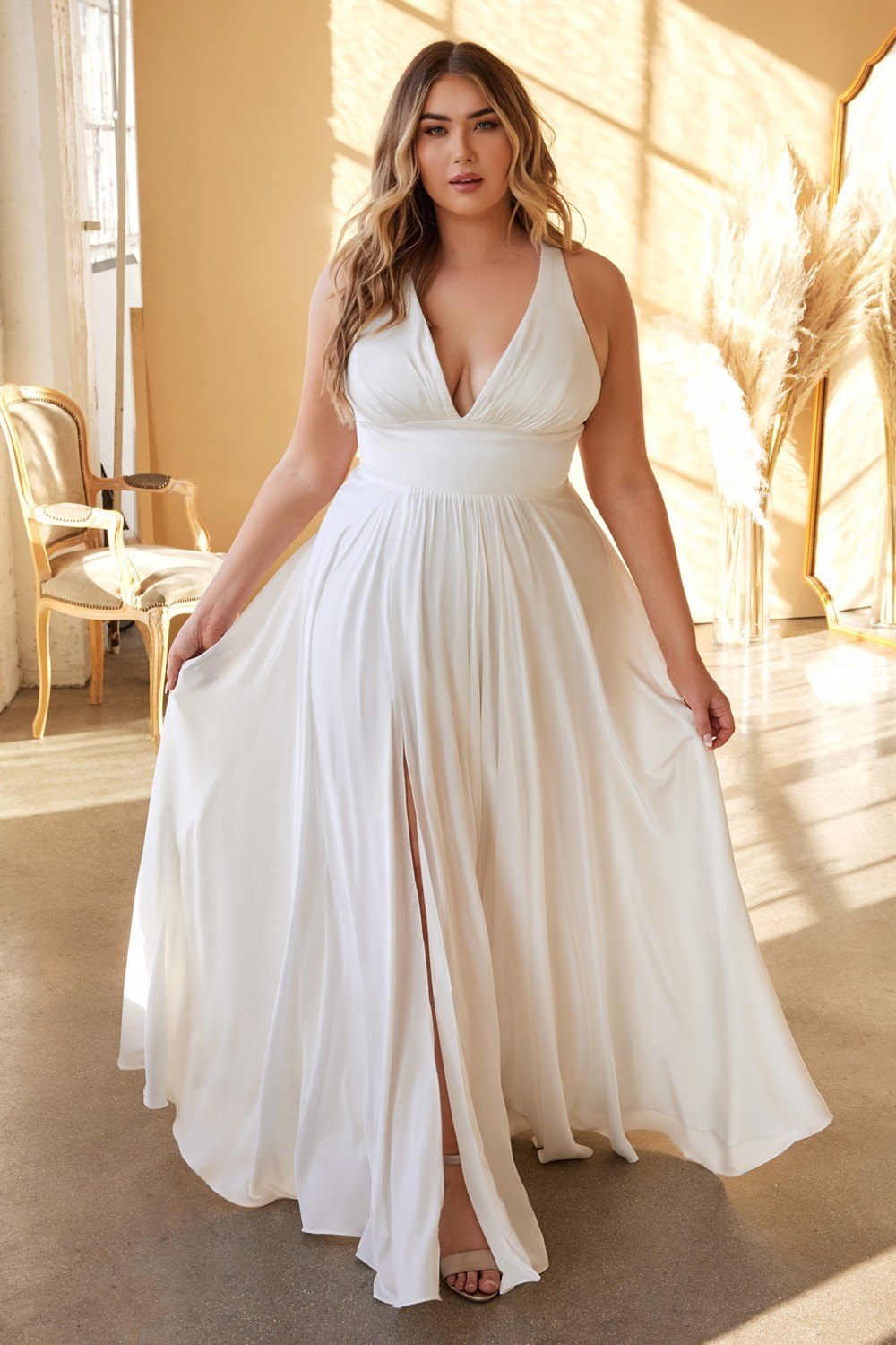 Long formal A-line satin dress with deep V neckline and sleeveless bodice, side slit