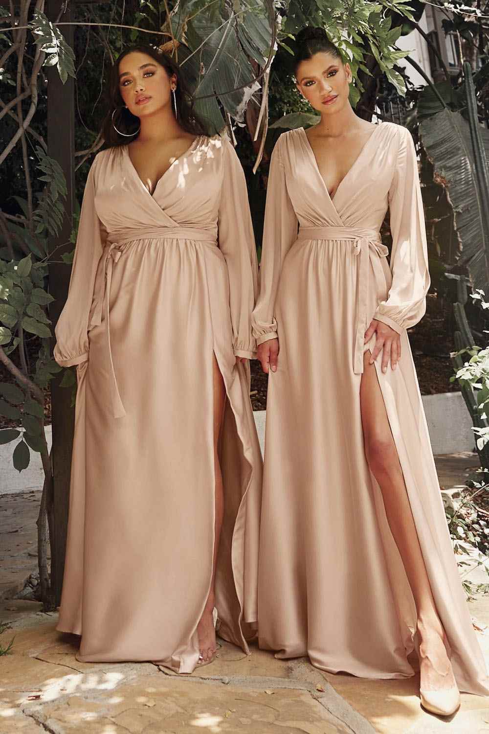 Long formal dress in pale blush with v-neck, gathered waist, and flowing skirt