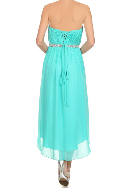 Turquoise strapless ruched bodice dress, back view with jeweled belt and asymmetrical hem