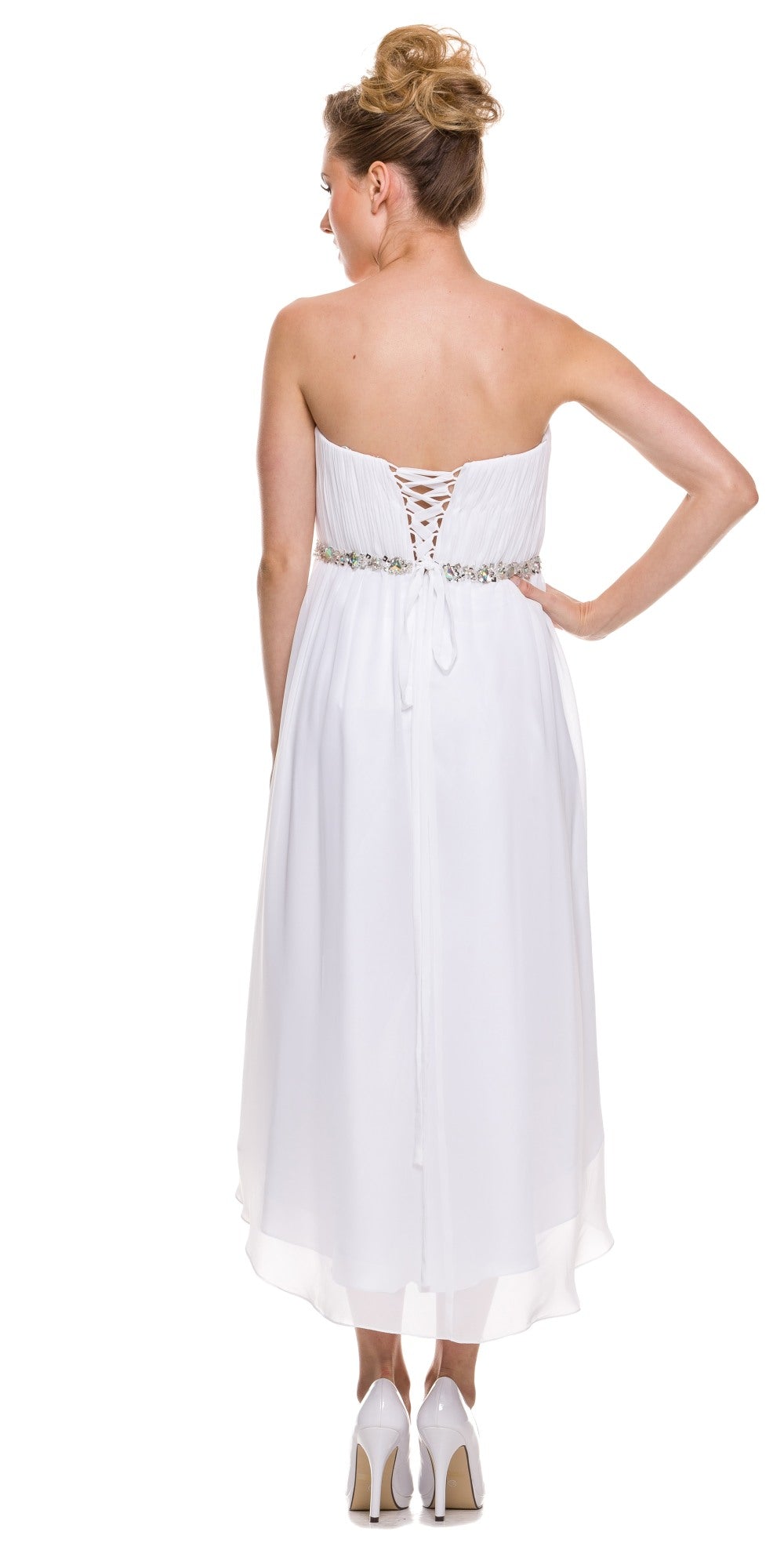 White strapless ruched bodice dress, back view with jeweled belt and asymmetrical hem