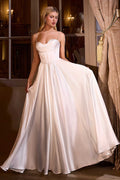 Off-white A-line bridal gown with pleated sweetheart bodice and spaghetti straps