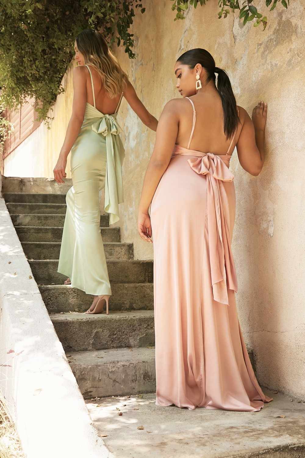 Peach satin maxi dress with open back and long tie bow at upper back