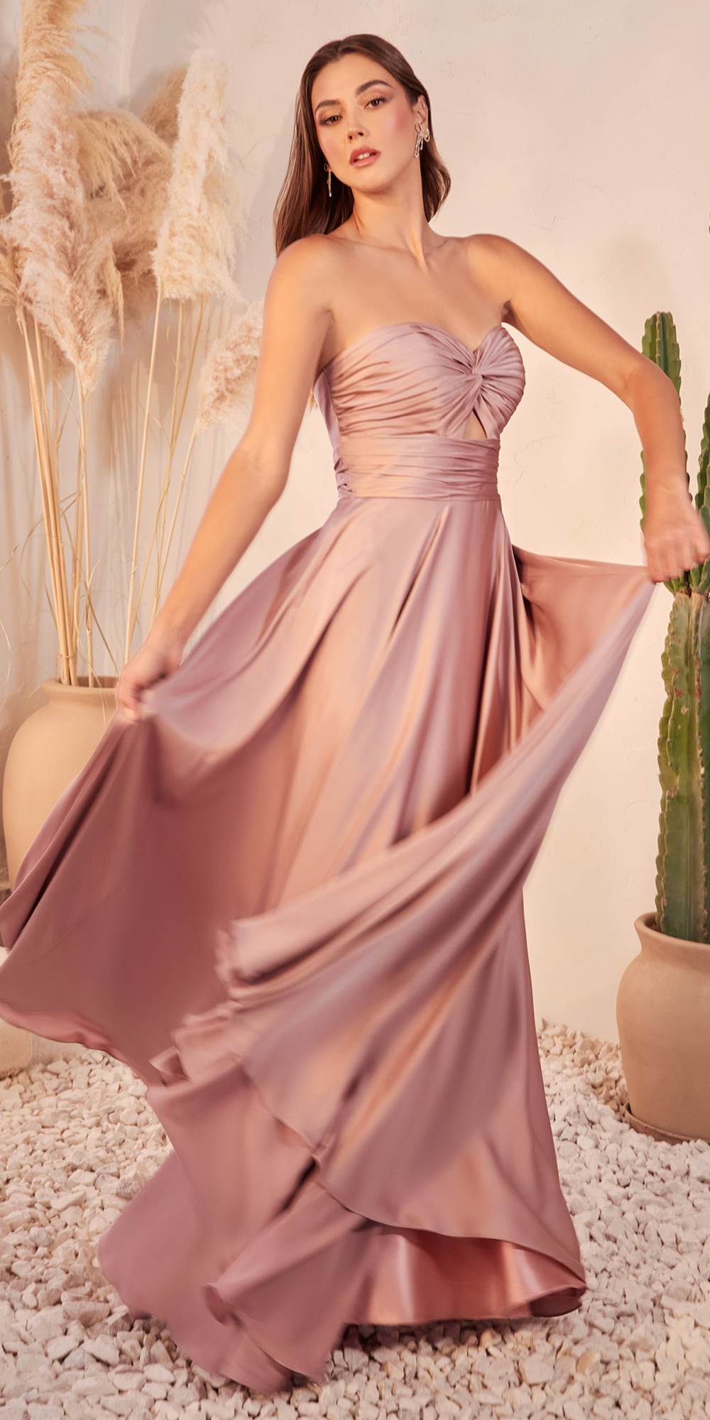 Blush satin strapless A-line gown with keyhole bust and ruched sweetheart bodice.