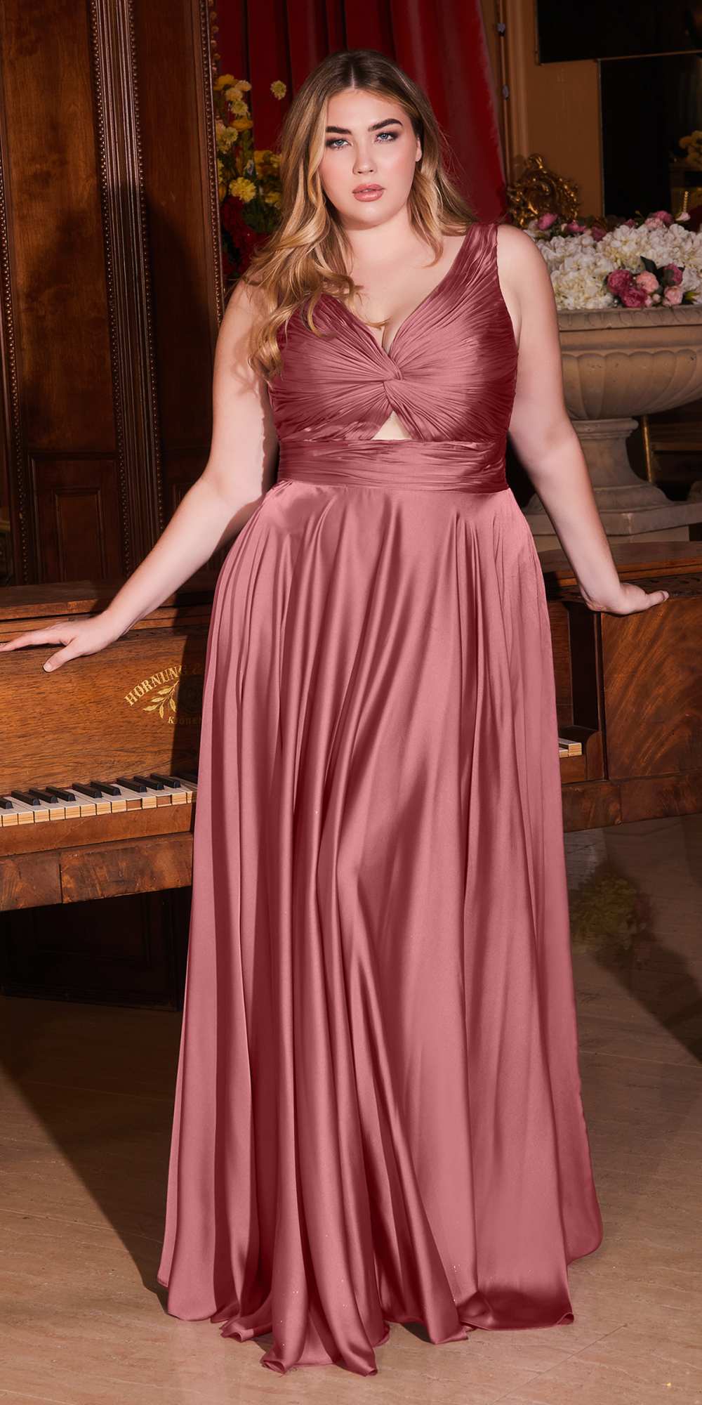 Formal satin A-line gown in mauve rose, twisted bodice with keyhole, gathered waist.