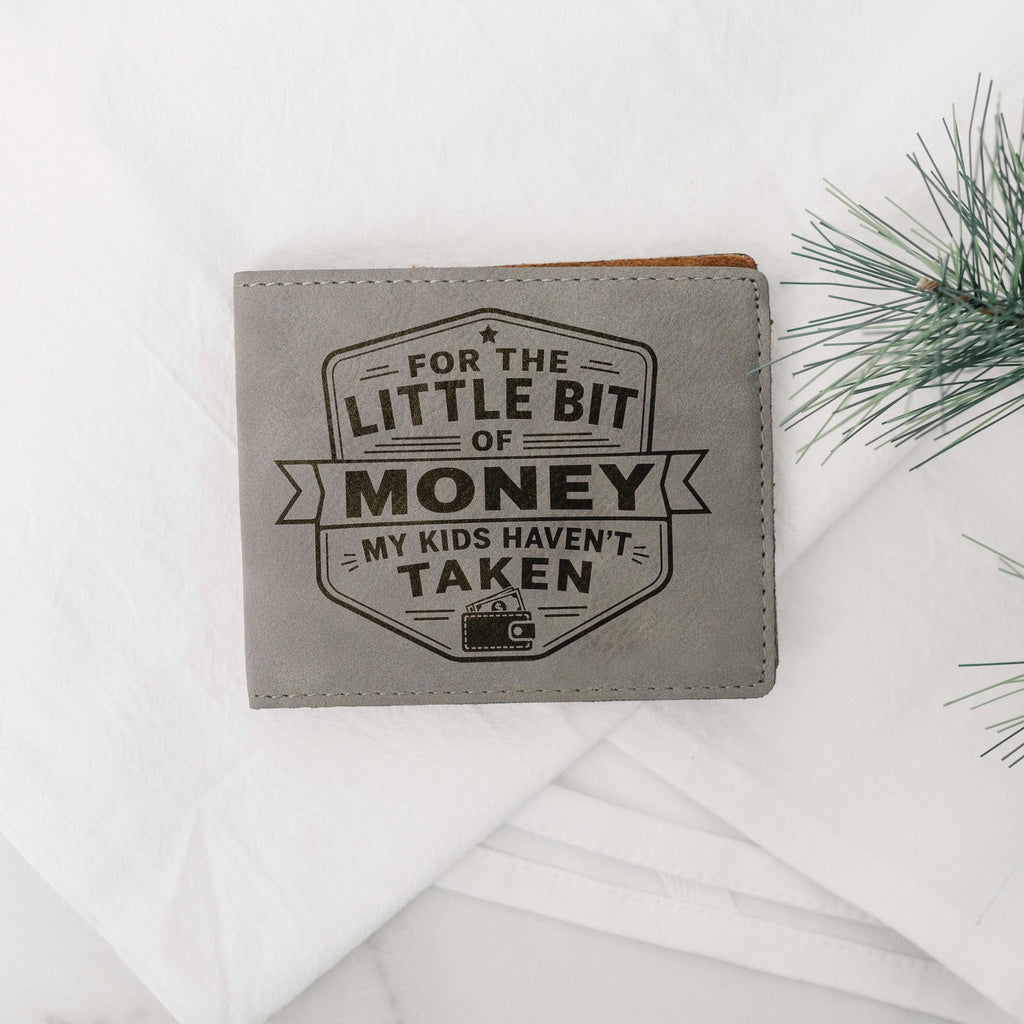 Slim gray leather bifold wallet with engraved money message on the front