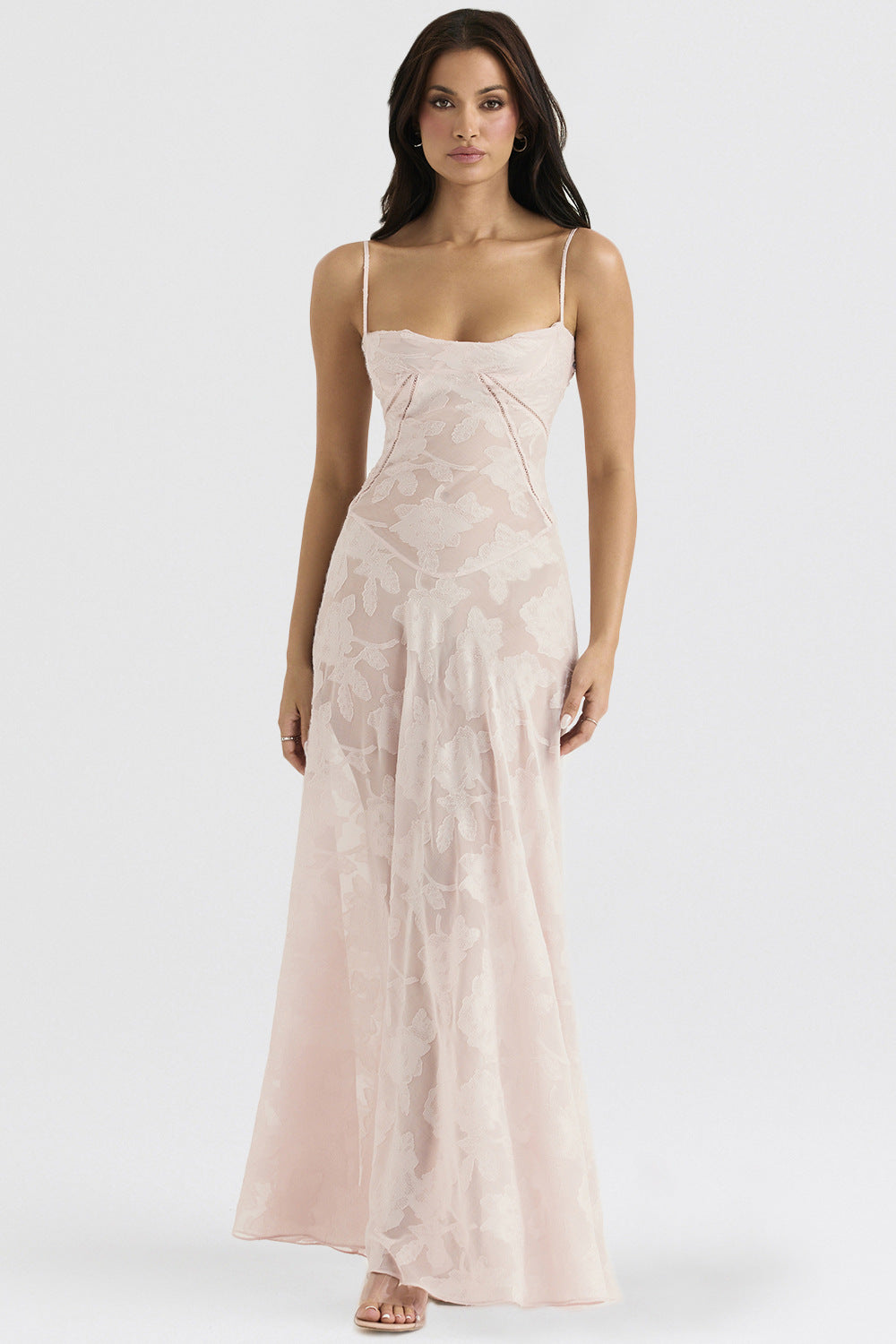Light pink lace suspender dress with floral pattern, spaghetti straps, and long full skirt