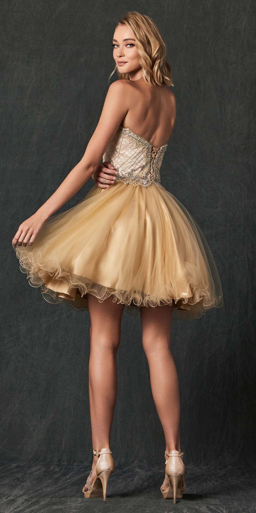 Gold strapless corset-back dress with beaded bodice and flared tulle skirt