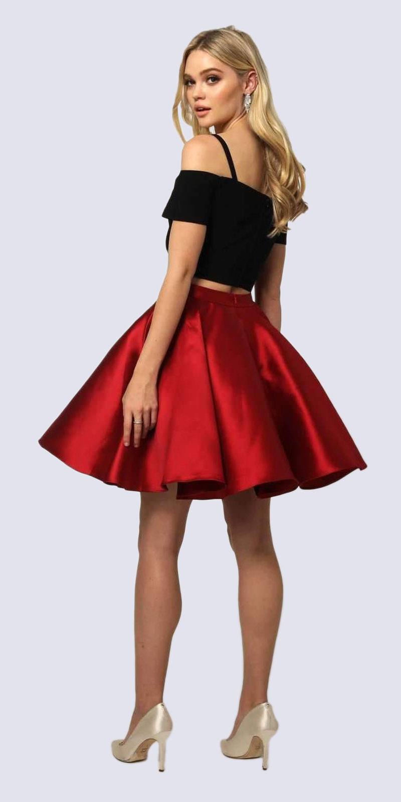 Two-piece cold-shoulder dress with black crop top and red pleated skater skirt