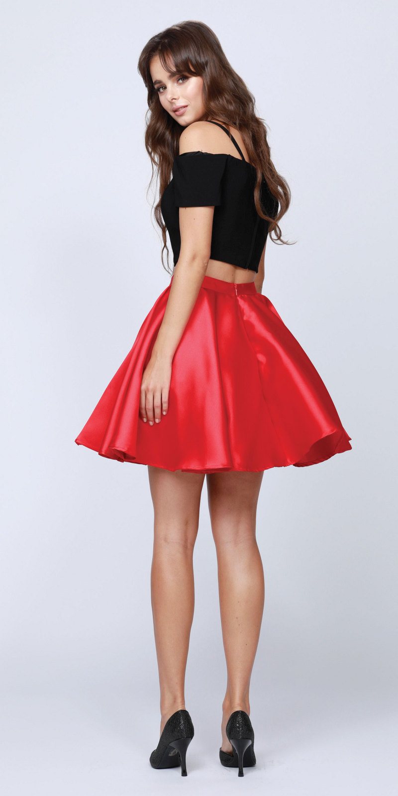 Two-piece cold-shoulder dress with black crop top and red pleated skater skirt