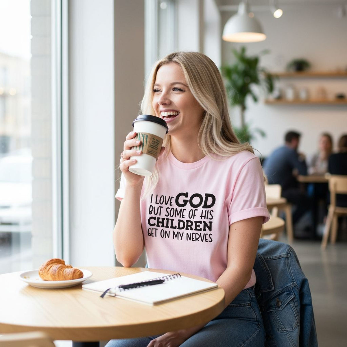 Light pink women’s T-shirt with black “I LOVE GOD… CHILDREN” text, short sleeves