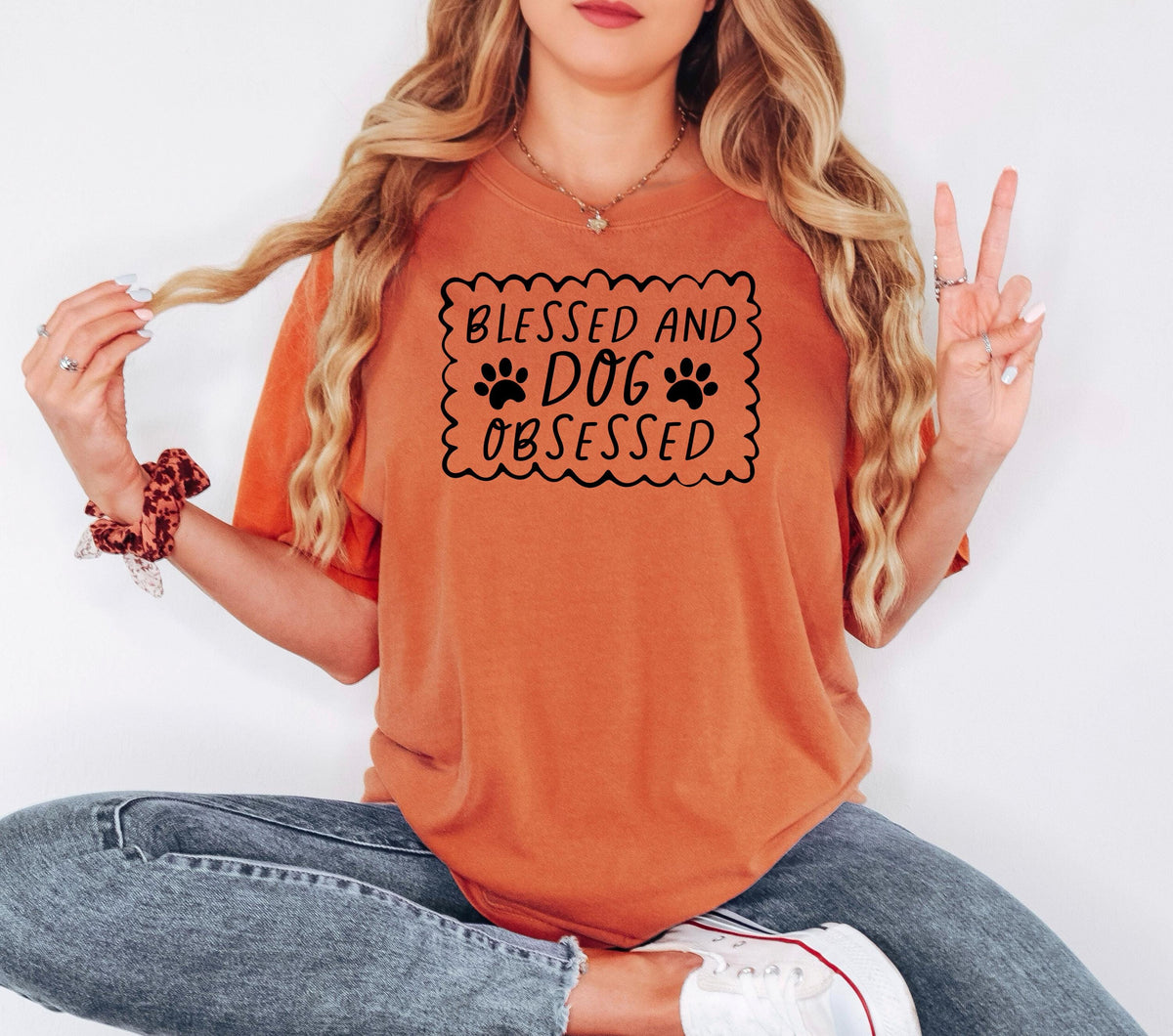 Rust orange short-sleeve T-shirt with “Blessed and Dog Obsessed” paw print graphic