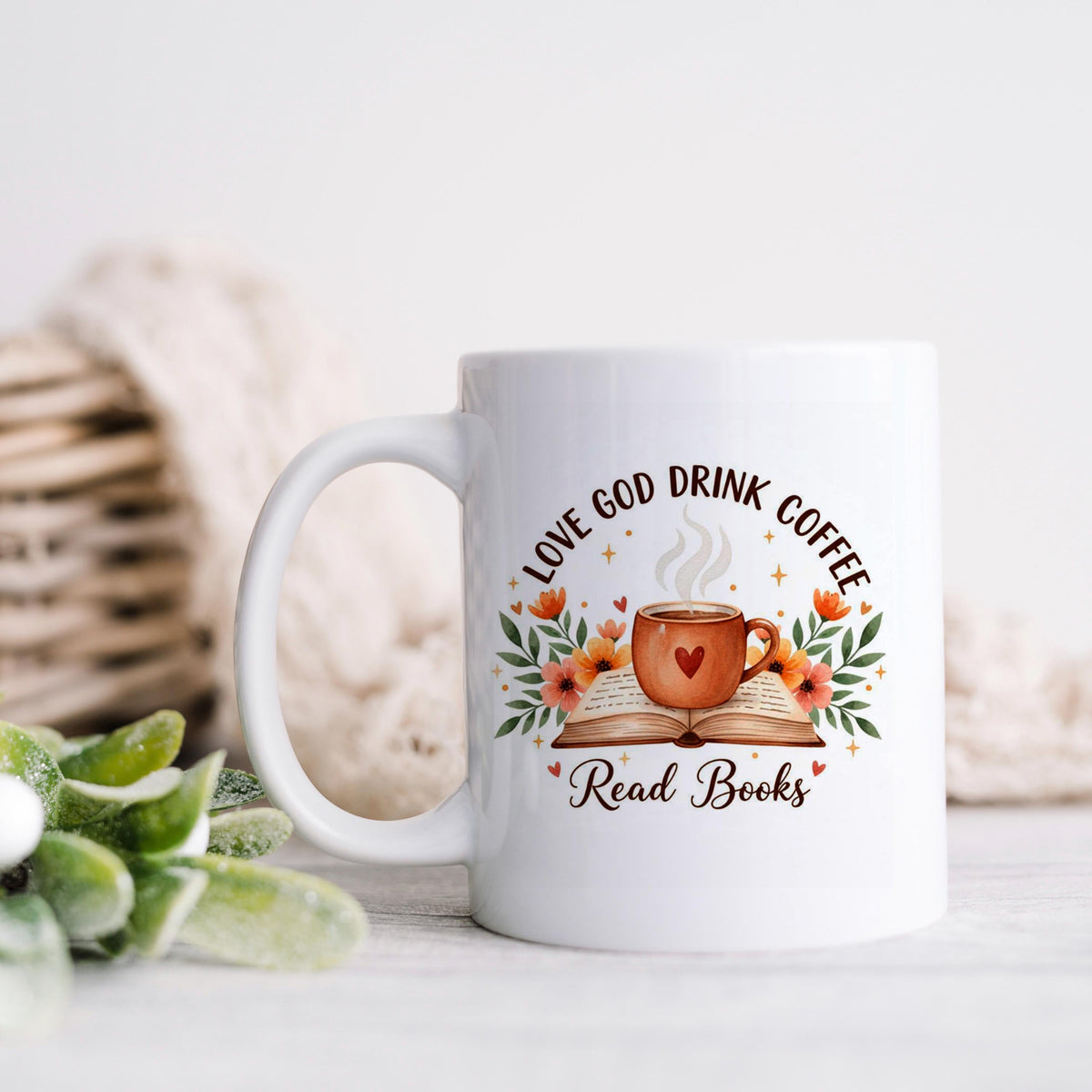 White ceramic coffee mug with floral faith quote and open book design